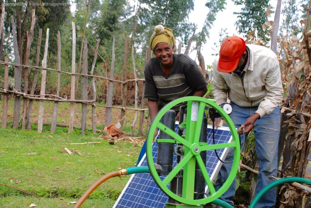 Ethiopian farmers use a solar-powered pump at the farm level. 